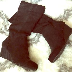 Black velvet slouchy knee high boots.